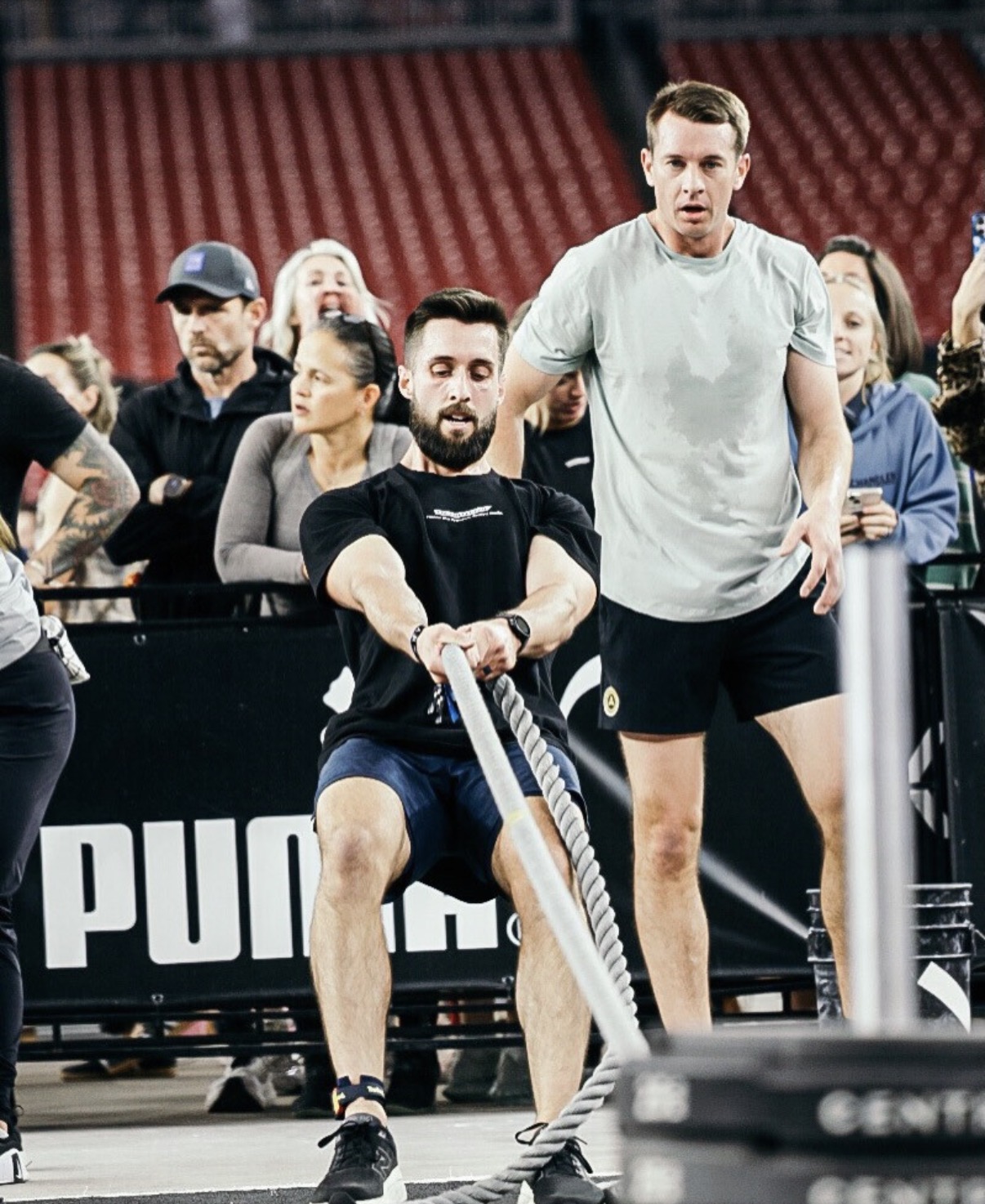 Caleb pulling a rope at a fitness event