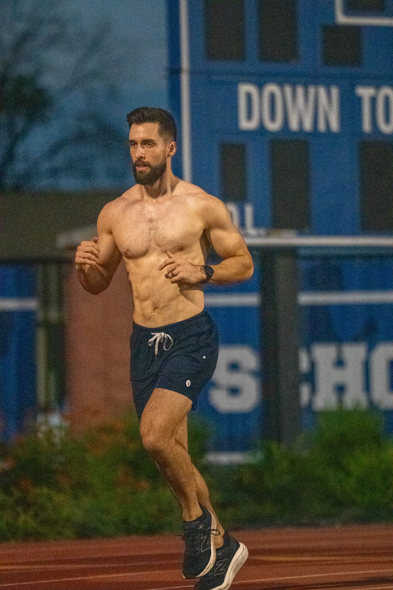 Caleb running on an outdoor track